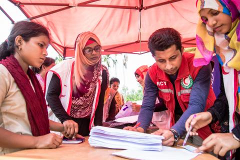four people planning emergency operations in bangladesh