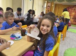 child participating in Bulgaria Red Cross piloting of IFRC and Sesame Workshop child play-based assessment tool