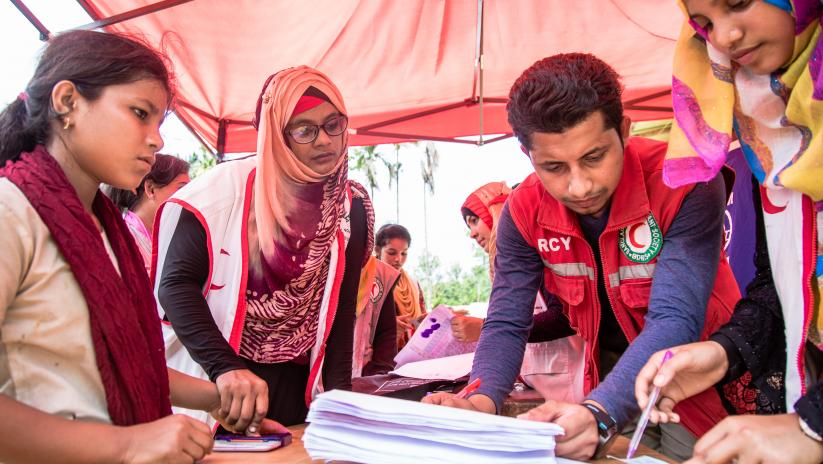 four people planning emergency operations in bangladesh